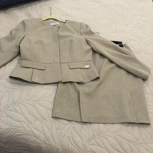 This is beautiful. Beige ladies skirt suit